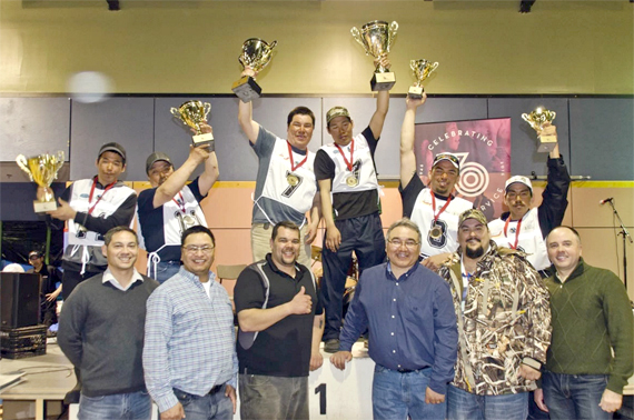 Ivakkak's top three winners hoist their trophies at an awards ceremony at the Kuujjuaq Forum April 12. Tasiujaq's Willie Cain Jr. and Daniel Cain Annahatak, centre, won the 2016 event with a total time of 30 hours and 55 minutes. In second place, Peter Ittukallak and Putugu Iqiquq of Puvirnituq, at left, finished in 31 hours and 42 minutes, while Kuujjuaq mushers George Kauki and Jikka Cain Snowball, at right, finished in third place in 32 hours and six minutes. A total of 12 teams competed in this year's race, which left Quaqtaq March 31 and followed the Ungava coast, stopping in Kangirsuk, Aupaluk, Tasiujaq and finally, Kuujjuaq. (PHOTO BY P. DUNNIGAN/IVAKKAK)