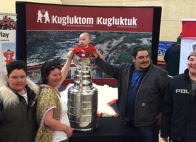 Kugluktuk Mayor Ryan Nivingalok and his wife Amy put their future Jordin Tootoo into the Stanley Cup April 28 during a Project North sponsored tour this spring in Nunavut. Famed NHL alumni Lanny McDonald and Mark Napier are joining the cup on its northern tour, shaking hands and signing autographs. Project North, with help from partners ScotiaBank, Canadian Tire, First Air and Adventure Canada, is bringing the cup to seven Nunavut communities this spring and, in Kugluktuk and Igloolik, they are donating 25 sets of new hockey equipment for kids. Project North, which launched seven years ago, has to date donated more than $700,000 worth of hockey equipment to 22 communities in Nunavut and two communities in Labrador. The cup is expected in Arctic Bay and Pond Inlet today and then it's on to Igloolik, Cambridge Bay and Yellowknife on Saturday, May 1. See more photos on our Facebook page. (PHOTOS COURTESY ADVENTURE CANADA)