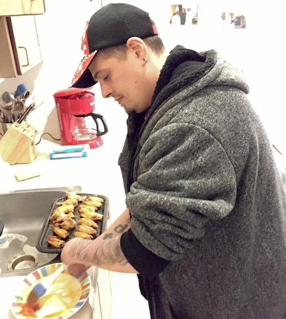 Persistence is everything: Even without hands, Romeo Tucci, as seen here in the kitchen of his Cambridge Bay home, can prepare some of his favourite foods. Before returning to the western Nunavut community, he spent two weeks at the Glenrose Rehabilitation Hospital in Edmonton. (PHOTO/ GOFUNDME.COM)