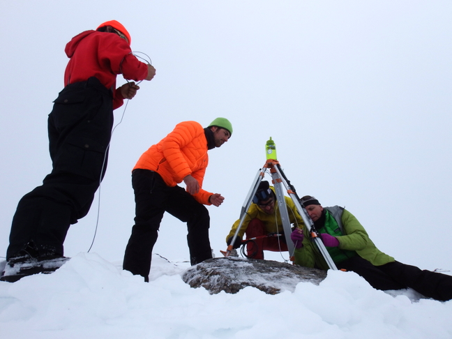 A team consisting of staff from Oceans North and the Université du Québec à Rimouski painstakingly install a tripod to mount a camera at Mt. Herodier near Pond Inlet. The camera is now sending images to a website to show local community members current weather and ice conditions in Eclipse Sound. (PHOTOS COURTESY OCEANS NORTH)
