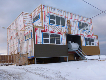 A house sits under construction in Kuujjuaq this past spring. The Quebec government recently amended legislation regulating hiring within the industry, which will lead the creation of a construction workforce placement region for Nunavik by June 2017. (FILE PHOTO)