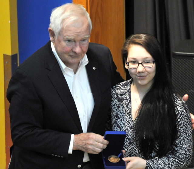 Arviat student Shelby Angalik shows off her Governor General's bronze medal for academics, which she received May 5 from the man himself, Governor General David Johnston. Johnston and his wife Sharon Johnston also met with Nunavut Commissioner Nellie Kusugak and the mayor and council while in Arviat, and later visited John Arnalukjuak High School. Their Excellencies are visiting eight Arctic communities this month during a Hudson Bay regional tour that began May 4 in Churchill, Man. This is the most extensive northern tour Johnston has ever made and will include stops in Chesterfield Inlet, Rankin Inlet, Coral Harbour, Cape Dorset, Salluit and Kuujjuaraapik-Whapmagoostui. That's all weather permitting, of course. (PHOTO BY ERIC ANOEE)