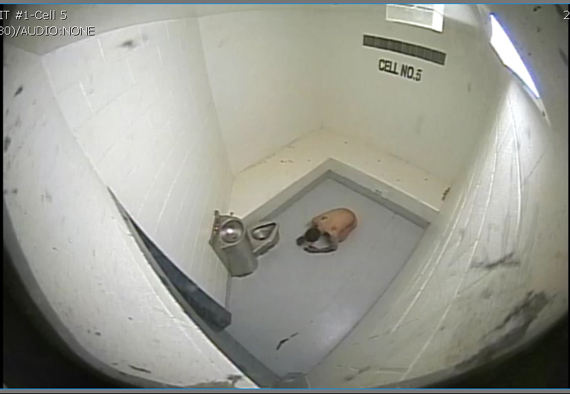 After RCMP officers leave Ejetsiak's cell Jan. 2, 2015 video footage provided to Nunatsiaq News shows the man lying hunched over his knees on the floor with a pool of blood collecting beneath his face.