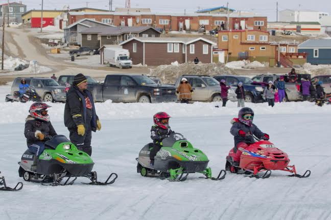 Kids get ready at the starting line May 21 to compete in a children's snowmobile race at this year's Omingmak Frolics festival in Cambridge Bay. The festival, which wrapped up May 23, featured activities and events for all ages including live music and dances, sporting events and feasts. (PHOTO BY RED SUN PRODUCTIONS) 
