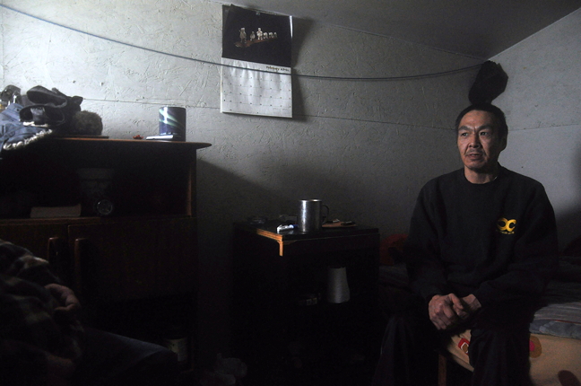Nushupiq Kilabuk inside the modest but sturdy shack he built for himself on the Iqaluit beach front. Kilabuk has been on and off homeless until he built himself his own shelter. The Nunavut government says it is hoping to devise a short term homelessness plan that could include cooperative or co-housing options. (PHOTO BY THOMAS ROHNER)