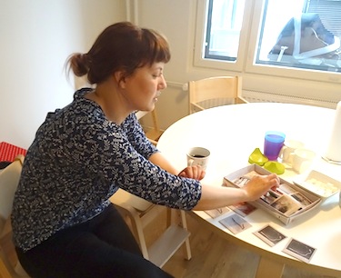 Ida-Maria Helander shows a memory game of Saami animals, tools and scenes used at the Máttabiegga Giellabeassi language nest. (PHOTO BY JANE GEORGE