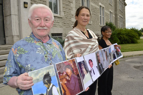 Residential school survivor Pita Irniq, human rights advocate Lieve Halsberghe and supporter Susie Utatnaaq stand before the Oblate-owned Edifice Deschâtelets at 175 Main St. in Old Ottawa East to protest the Oblate order’s 200th anniversary this year. (PHOTO BY JIM BELL)