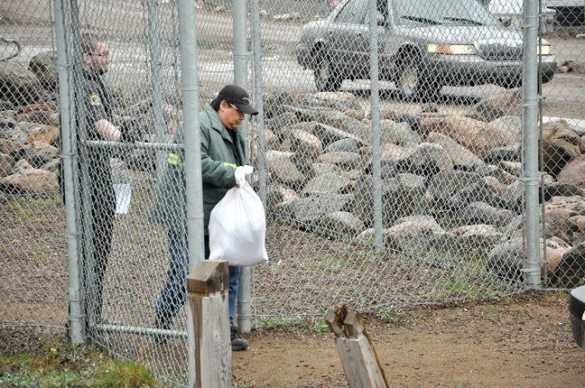 Now a free man, Adrian Van Eindhoven walks out of the Iqaluit courthouse shortly after 5 p.m. July 15 carrying a white sack filled with his possessions. A Nunavut deputy judge accepted a joint submission from Crown and defence lawyers that saw Van Eindhoven plead guilty to manslaughter in the brutal 2004 stabbing death of Leanne Irkootee in Rankin Inlet. Van Eindhoven, in prison for more than 12 years, successfully appealed two second-degree murder convictions before pleading guilty to manslaughter July 15. Shortly after leaving the courthouse, Van Eindhoven, who will relocate to Winnipeg, departed in a taxi. Read more later on nunatsiaqonline.ca. (PHOTO BY THOMAS ROHNER)
