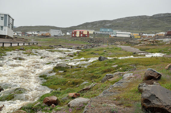 A two-day rainfall that could reach 60 to 70 mm by the evening of July 22 in Iqaluit has swollen local creeks, such as the Kuugalaaq, which runs through downtown. (PHOTO BY THOMAS ROHNER)