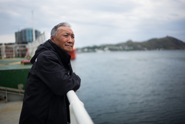 James Qillaq, mayor of Clyde River, gazes out to sea Aug. 6 from the deck of the MV Arctic Sunrise, a Greenpeace icebreaker, on its way from St. John's, Nfld., to Qillaq's home community loaded down with 27 solar panels to install on the Clyde River community hall. Greenpeace organizers, and local supporters such as Qillaq and former mayor Jerry Natanine, who is also on board the Arctic Sunrise, hope the solar installation will inspire other residents, and other communities, to consider renewable energy options to supplement dirty diesel power on which Nunavut's power system depends. The two-week visit, which expects to include an appearance by movie star and climate change activist Emma Thompson, is also an attempt by Greenpeace to strengthen its relationship with Canadian Inuit and counsel them on how to effectively oppose seismic testing Baffin Bay and Davis Strait. They expect to arrive in Clyde River later this week. (PHOTO BY GREENPEACE)