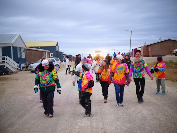 Marchers in bright t-shirts walk around Cambridge Bay Sept. 7 in the western Nunavut community's Embrace Life event. (PHOTO BY JANE GEORGE)