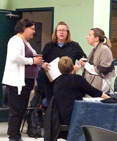 INAC and TMAC officials huddle to settle unresolved issues during the water board hearings held in Cambridge Bay's Luke Novoligak community centre. (PHOTO BY JANE GEORGE)