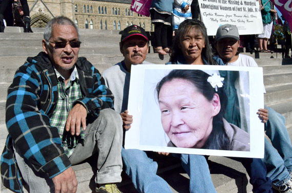 The late Annie Pootoogook’s brother, Pauloosie Joanasie, and her cousin Kilatja Simeonie, display a photo of the beloved artist with Simeonie Kunnuk (to their left) and Norman Igloopialik (to their right) at a noon hour vigil at Parliament Hill Oct. 4 that was held to demand justice for missing and murdered Indigenous women and girls. Organizers dedicated the event to Annie Pootoogook’s memory and Inuit in Ottawa flocked there for a big demonstration of solidarity. Sytukie Joamie of Iqaluit, now an Inuit knowledge keeper in Ottawa, said he respects police officers who dedicate their lives to public service but he denounced racist comments posted recently on the Ottawa Citizen’s website by an Ottawa Police Service sergeant. Prime Minister Justin Trudeau also spoke at the event. Read more on Nunatsiaqonline.ca. (PHOTO BY JIM BELL)