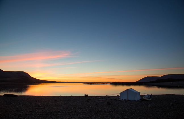 Tenting on the shores of Victor Bay, near Arctic Bay, at sunrise, Aug. 29. The northern tundra is turning rust and orange in the southern Arctic and further north, ice and snow have already returned. Get your camping in while you can. (PHOTO BY CLARE KINES)