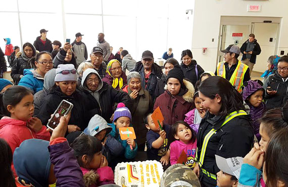 Inukjuamiut greeted Haney with a handmade signs, decorations and an Air Inuit-themed cake that read: “Inukjuamiut are honoured and proud of you Captain Haney.” (PHOTO BY CAROLINE OWEETALUKTUK)