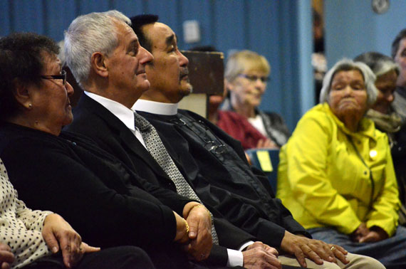 The late Bryan Pearson's brother, Robert Pearson, sits between Martha Tikivik and the Very Rev. Jonas Allooloo, while elder Inuapik Sageatok looks one, at a memorial service for Pearson held Oct. 17 in Iqaluit. (PHOTO BY JIM BELL)