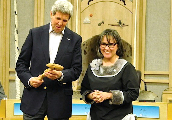 U.S. Secretary of State John Kerry—the current chair of the Arctic Council, holds the gavel handed to him by then-Nunavut MP Leona Aglukkaq, the Canadian environment minister and minister responsible for the Arctic Council, at the end of the April 2015 Arctic Council ministerial gathering in Iqaluit. With that, the chair of the Arctic Council passed to the U.S. until 2017. (PHOTO BY THOMAS ROHNER)