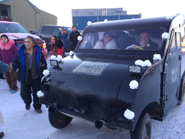 Jordan and Chelsey St. John prepare to take off after their wedding Nov. 19 in Arviat in their vintage Bombardier vehicle. A few of these old machines are still running and some are even used for transportation between Arviat and Churchill, Man. This one, likely dating back to the 1950s, is owned by Jordan St. John. (PHOTO BY NOEL KALUDJAK)