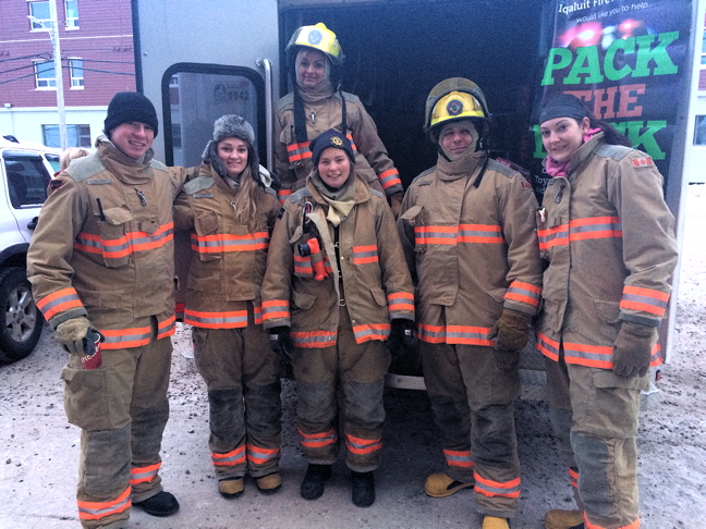 Iqaluit firefighters braved not fire but cold Dec. 10 to collect food and toy donations outside the Arctic Ventures grocery store. Firefighters were trying to fill an ambulance with Christmas goodies to help local charities including the Angel Tree Society, which gives away toys to needy families at Christmas. If you were unable to make a donation over the weekend, you can still drop off new toys and non-perishable goods at the Iqaluit fire hall. (PHOTO BY STEVE DUCHARME)