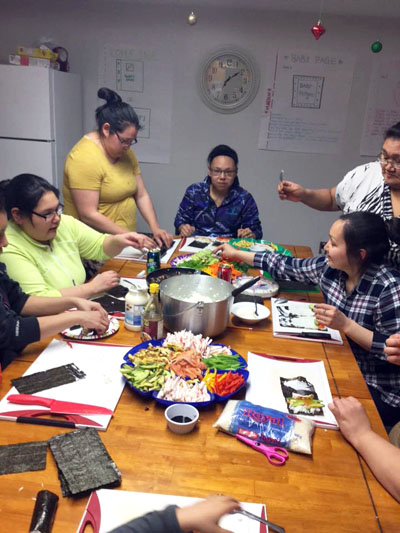 Qarmaapik House offers a twice weekly community kitchen workshop, which teaches community members to prepare healthy meals. Participants made sushi on night earlier this month. (PHOTO BY N. ETOK)