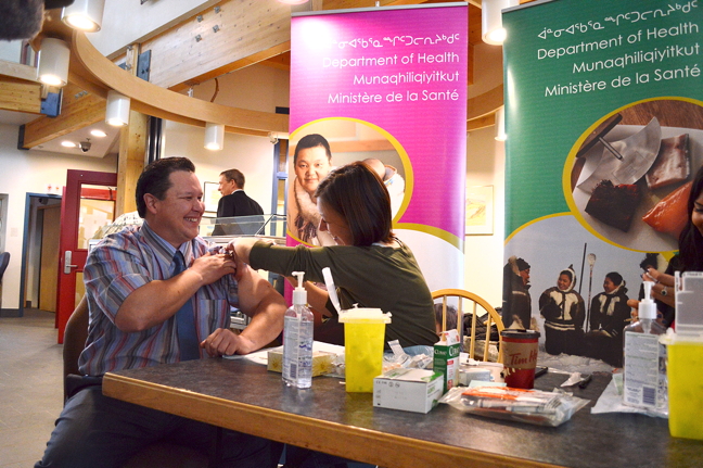 Nunavut Health Minister George Hickes gets a flu shot this past Oct. 21 at the Nunavut legislature. The GN says everyone over the age of six months should get the flu vaccine, which is available at community health centres. (FILE PHOTO)