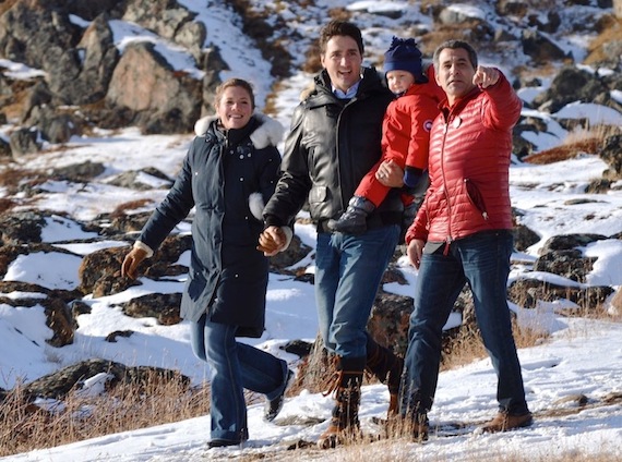 Sophie Grégoire, the wife of Liberal Party leader Justin Trudeau, Trudeau, holding his youngest child Hadrien, and Liberal candidate Hunter Tootoo walk into Iqaluit's Rotary Park during Trudeau's last visit to Iqaluit Oct. 10. (PHOTO BY STEVE DUCHARME)