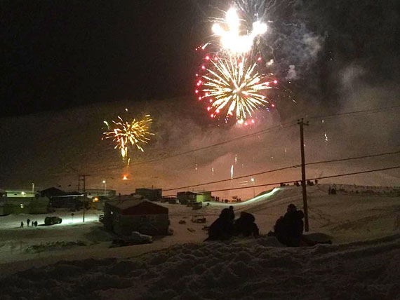 A delayed, but beautiful welcome to 2017: People in the Nunavik community of Salluit watch a spectacular fireworks display Jan. 6. First scheduled for Dec. 31, the fireworks were delayed due to poor weather and a large-scale search-and-rescue operation around the community for a missing man on a snowmobile, Steven Yuliusi, whose body was found Jan. 4. (PHOTO BY PATRICIA CAMERON)
