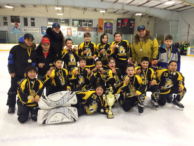 Members of the Rankin Rock hockey team show off the gold medals they won in a tournament Jan. 27 to Jan. 29 in Rankin Inlet. The Rock beat out Coral Harbour in the final and Arviat beat out Naujaat in a tight one-goal lead to take the bronze. Seven teams competed in the tournament including teams from Baker Lake, Naujaat, Arviat, Coral Harbour and three teams from Rankin Inlet. (PHOTO BY NOEL KALUDJAK)