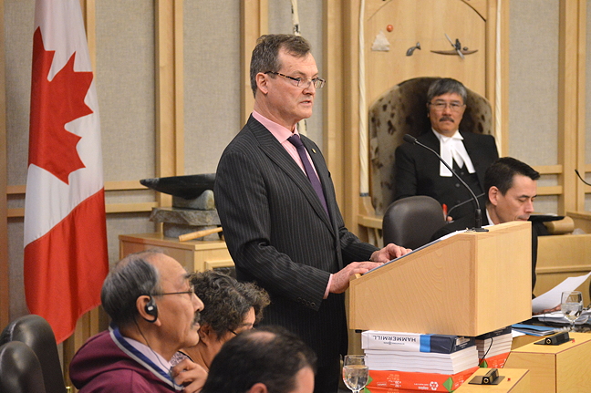 Nunavut Finance Minister Keith Peterson stands in the Nunavut Legislative Assembly Feb. 22 to deliver the territory's nearly $2 billion operations budget for 2017-18. (PHOTO BY STEVE DUCHARME)