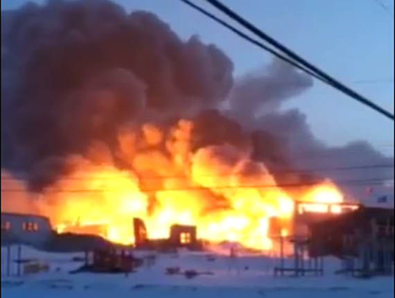 A fire started late Feb. 28 and burned overnight, completely destroying Kugaardjuq school in Kugaaruk. Police have charged a 13-year-old local youth with arson in connection to the fire. (FILE IMAGE)