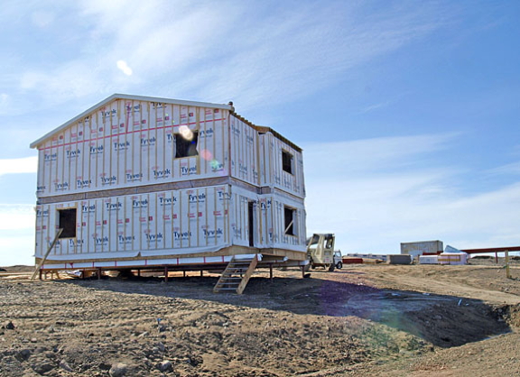 A home under construction in Iqaluit's Plateau neighbourhood in 2011, a year in which 222 residential units were developed. Fewer than half that were under construction in 2016. (FILE PHOTO)