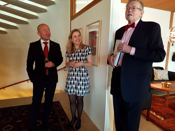 Kenn Harper with set of bound volumes of research he's done on the history of Hans Island that he presented to Niels Boel Abrahamsen, the Danish ambassador to Canada, and Abrahamsen's wife, Karen Eva Abrahamsen, at a reception March 27 in Ottawa. (PHOTO BY JIM BELL)