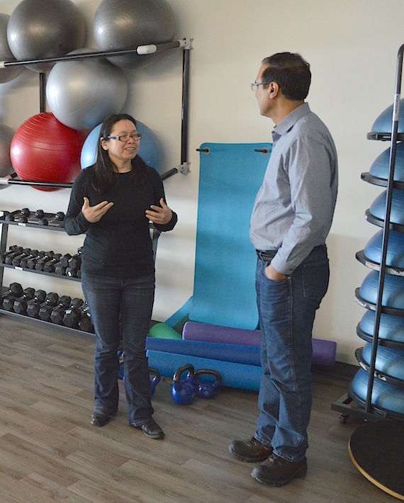 Iqaluit Mayor Madeline Redfern speaks to Amarjeet Sohi, MP for Edmonton Mill Woods and the federal minister for Infrastructure and Communities, on a tour of the Iqaluit Aquatic Centre May 5. 