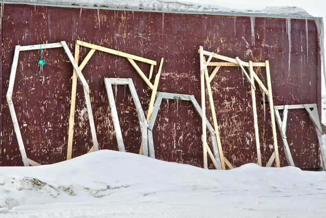 Spot the hunter. You can usually tell the home of a hunter when you see iinirviit, the homemade apparatus used to dry and stretch animal skins. These were spotted in Iqaluit May 4, across from the old hospital, leaning up against a building often used by Inuit for crafts and building things. (PHOTO BY FRANK REARDON)
