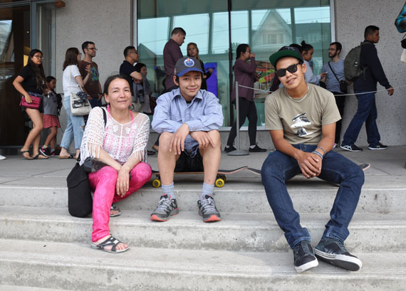 Alasuak Akesuk, her son and artist Latch Akesuk and Parr Josephie pictured outside of the Art Gallery of Ontario June 28 ahead of the opening of an exhibit featuring the work of the two Cape Dorset youth. (PHOTO BY SARAH ROGERS) 