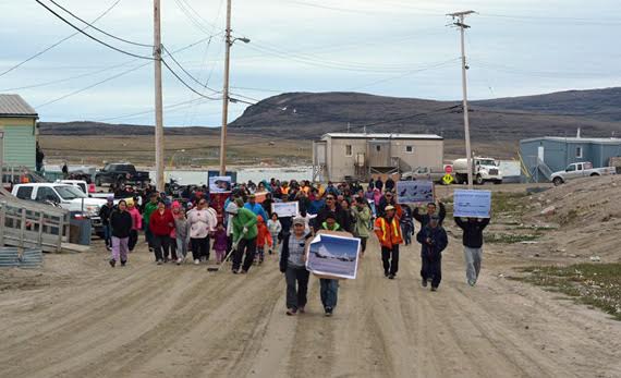 BREAKING: The Supreme Court of Canada has quashed a decision that the National Energy Board issued in June 2014 to approve a seismic testing project in Baffin Bay, saying the NEB breached their duty to consult the Inuit of Clyde River. Here, residents take part in a 2014 march in opposition to planned seismic testing in the waters of eastern Nunavut. Read more coverage of the ruling later on nunatsiaqonline.ca. (FILE PHOTO)