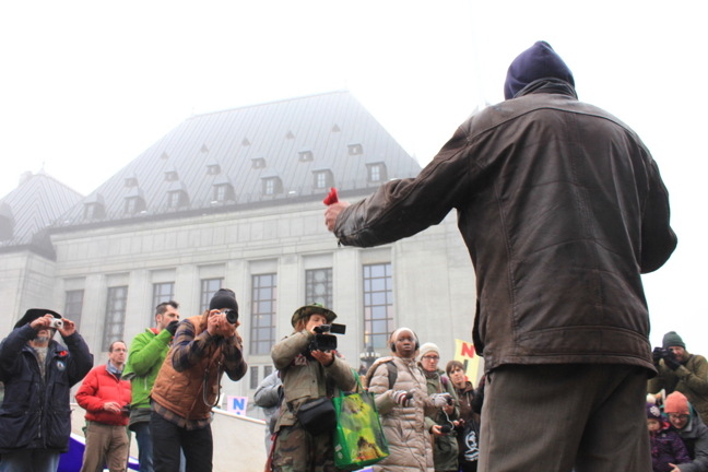 Jerry Natanine, Nunavut seismic testing opponent and former mayor of Clyde River, speaks to supporters in front of the Supreme Court of Canada Nov. 30, 2016. (PHOTO BY LISA GREGOIRE)