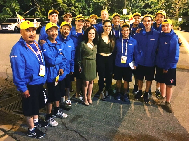 Team Nunavut’s male 19-and-under volleyball team with Pangnirtung artist Riit Mike, centre right, and Kathleen Merritt, at the opening ceremonies of the 2017 North American Indigenous Games in Toronto, July 16. The Nunavut contingent is made up of 44 youth aged 13 to 19 on four sports teams. (PHOTO COURTESY RIIT MIKE)