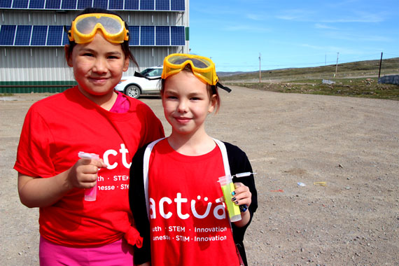 Cynthia Kilabuk, right and Madeleine Merkosak, left, both aged nine, get ready to launch their rockets at a July 21 science camp in Iqaluit. (PHOTO BY BETH BROWN)