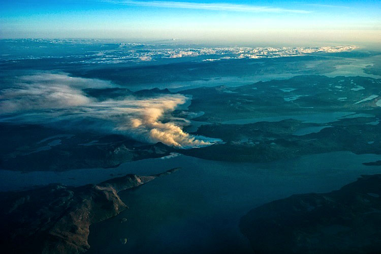 Smoke spirals up into the air from a fire near Sisimiut in this photo taken by Air Greenland pilot Lasse Reiding the night between Aug. 3 and Aug. 4.