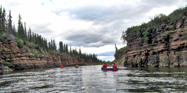 The team, sponsored by the Geological Survey of Canada, spent a month paddling down, and camping along, the Coppermine River, from Dismal Lakes to Kugluktuk, dropping off rock and fossil samples to small bush planes at designated check points along the way. 