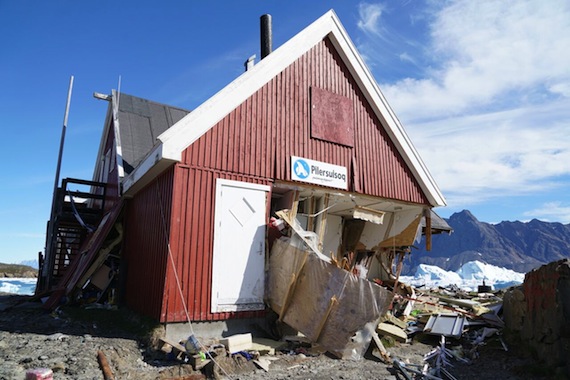 A store in Nuugaatsiaq, a village in northwestern Greenland, lurches to one side in this photo taken more than two weeks later by experts sent in to evaluate the tsunami that hit the village June 18. (PHOTO BY HERMANN FRITZ)