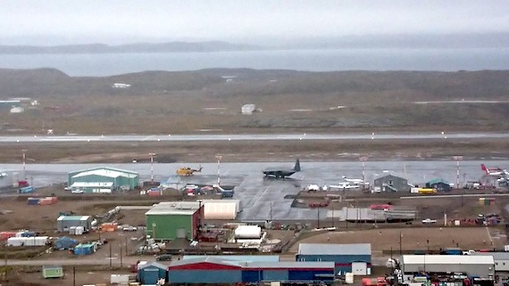 An RCAF Hercules aircraft, right, and a Cormorant helicopter, left, which were involved in a search effort for missing boaters south of Iqaluit in Frobisher Bay, sit on the tarmac at the Iqaluit International Airport during the late afternoon of Sept. 4. The crew of the Cormorant found the overdue boaters at about 3:30 a.m., Sept. 5. (PHOTO BY KENNETH BELL)