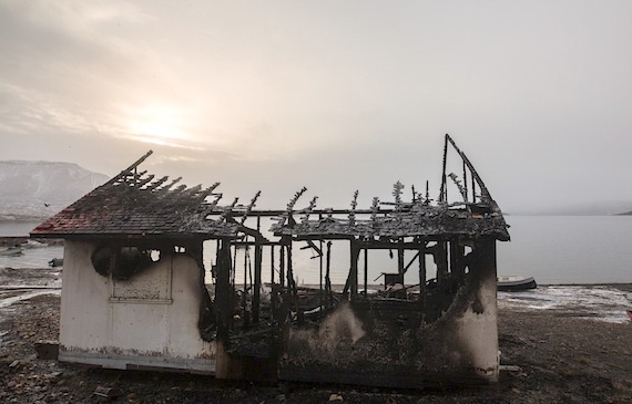 All that remains Sept. 14 of an Arctic Bay landmark—built in 1941 by Canada and the United States as a meteorological station—are charred roof supports and walls. A fire destroyed the building overnight, Sept. 13 to Sept. 14. 2017. The Nunavut RCMP is investigating the cause of the fire.The building was unoccupied at the time of the fire and was not connected to any power source. Due to the fire damage and for the safety of the public, the building will be demolished, the RCMP said Sept. 15. (PHOTO BY CLARE KINES)