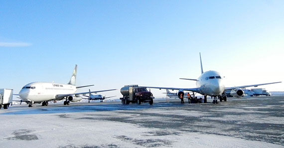 Aircraft from Nunavut's two biggest airlines, First Air and Canadian North, parked on the tarmac in Rankin Inlet. The GN has just awarded a new contract to a German consulting firm to re-evaluate its medical travel and duty travel contracts. (FILE PHOTO)