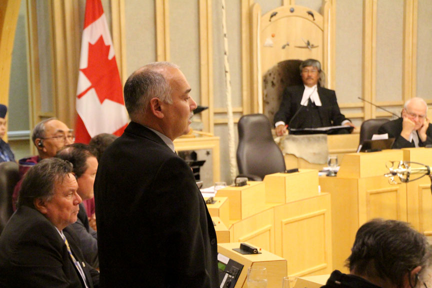 Nunavut Environment Minister Joe Savikataaq answers Uqqummiut MLA Pauloosie Keyootak’s questions about the Government of Nunavut's Wildlife Damage Compensation Program. Keyootak said his constituents are struggling with the GN’s lengthy process for approving compensation claims for damage caused by wildlife. (PHOTO BY BETH BROWN)