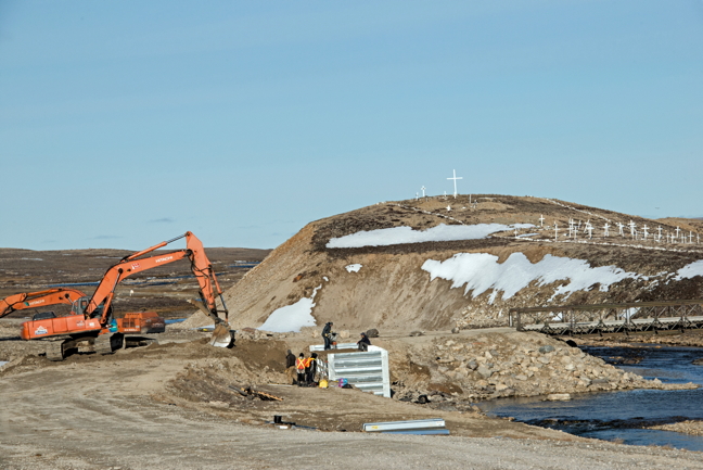 Construction begins on a new bridge over Freshwater Creek in Cambridge Bay, seen here Sept. 14. Mayor Jeannie Ehaloak says the hamlet managed to secure multi-year funding to replace the Fresh Water Creek bridge and that the project includes roadwork to Mount Pelly and Ovayok Park. She said it would take two summers to complete. This new bridge will eventually replace the Bailey Bridge. (PHOTO BY DENISE LEBLEU IMAGES)