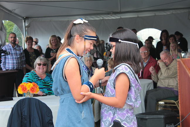 Tarniriik, an Ottawa throatsinging duo made up of Samantha Kigutak-Metcalfe and Cailyn Degrandpré, entertain the crowd gathered for the unveiling of the new qamutik sculpture in South Ottawa. The crowd enjoyed their talents, and giggles.