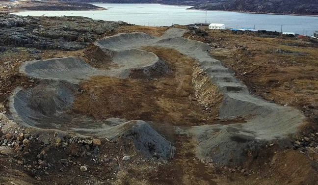 Nunavut's first full BMX track is now ready to shred—but likely won't see much riding until next summer now that it's covered in snow. A collaboration in Cape Dorset between the hamlet's recreation director Will Sandoval and local volunteer Claude Constantineau, along with youth, other volunteers and local sponsors, the new BMX track took about a year to design and build and will likely attract a lot of use, come spring. The pump track—a track designed to keep riders moving without having to pedal—is built on reserve land the hamlet is not currently using. (PHOTO BY CLAUDE CONSTANTINEAU)