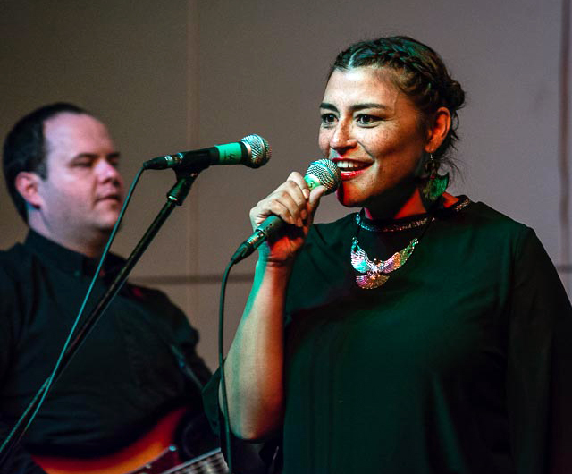 Nunavik singer Elisapie Isaac performs for a crowd in Inukjuak Oct. 27. Her show capped off a week of dance and music in the Hudson coast community, including a show by Iqaluit's The Jerry Cans, following the annual Saangautiniq dance competition. (PHOTO BY SYLVAIN PARADIS) 
